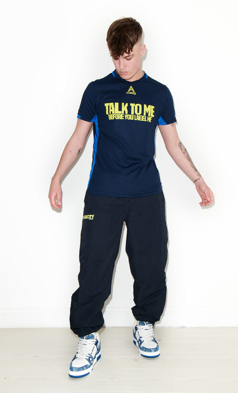 Talk To Me Before You Label Me Football Tee in Navy and Yellow