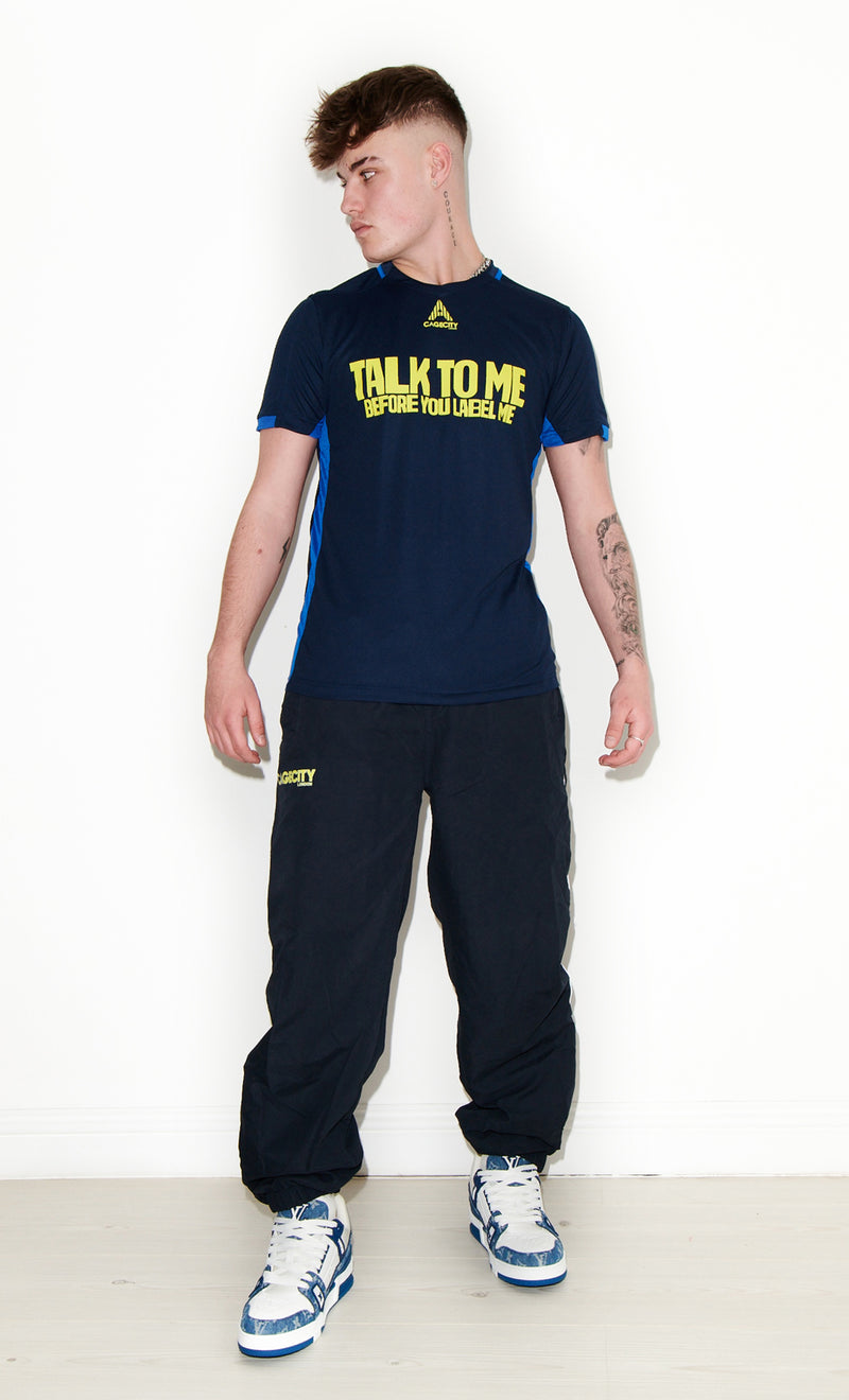 Talk To Me Before You Label Me Football Tee in Navy and Yellow